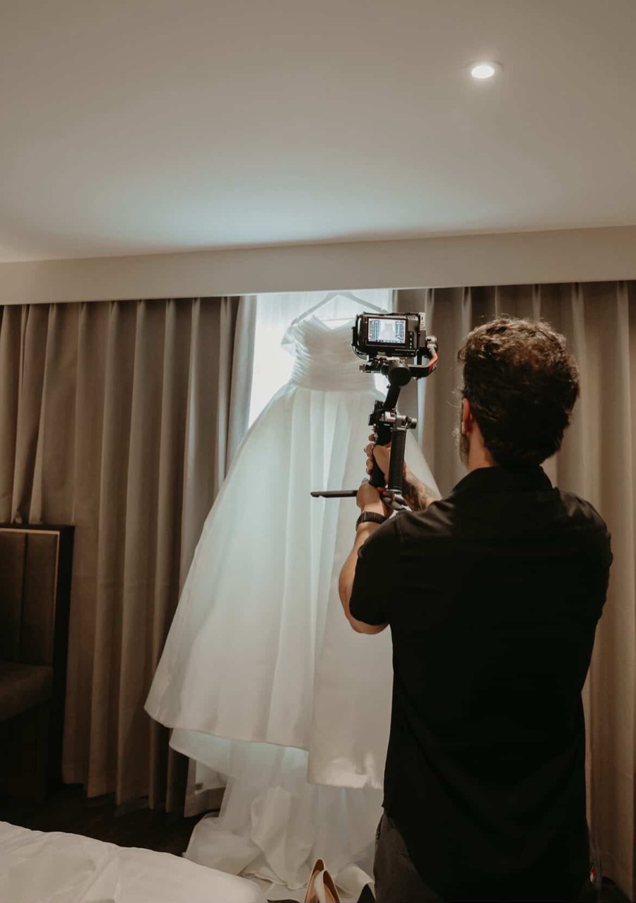 Leo Peres filming bridal dress details before the ceremony